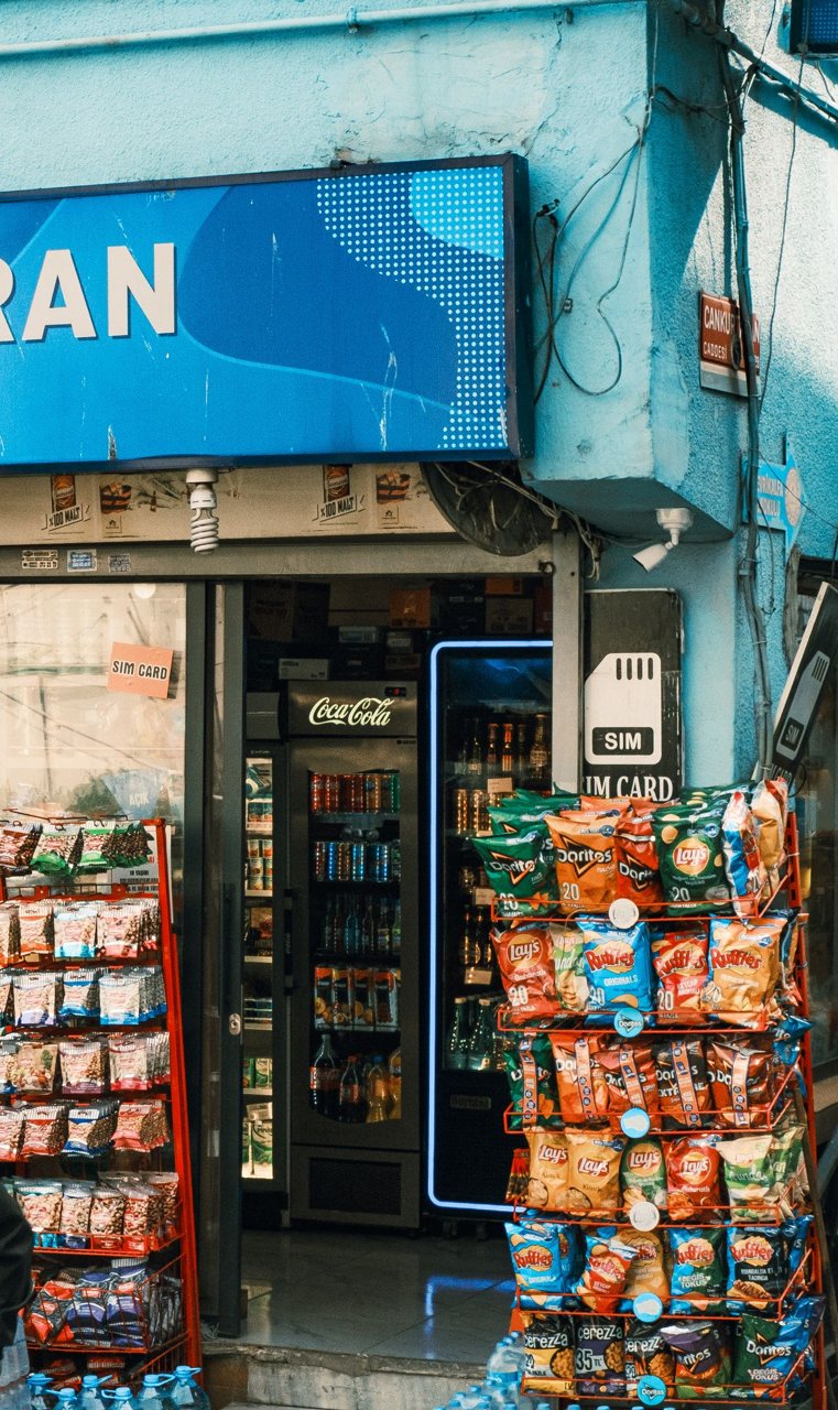 Free A vibrant display of snacks and SIM cards at a local convenience store entrance. Stock Photo